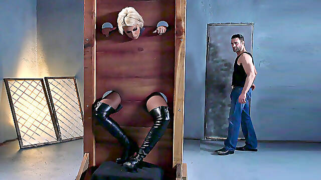 Bridgette B is put into the pillory and gets her both holes fingered