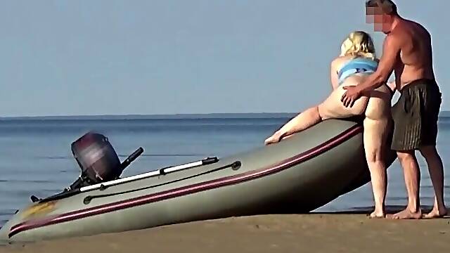 MILF blonde beach babe takes it in the sand