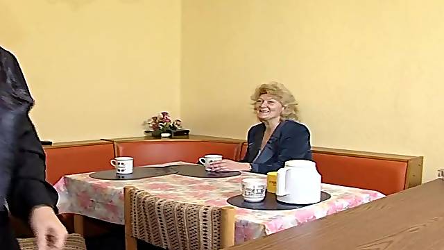 Older blond granny is getting hard banging on the table and that babe enjoys it a lot